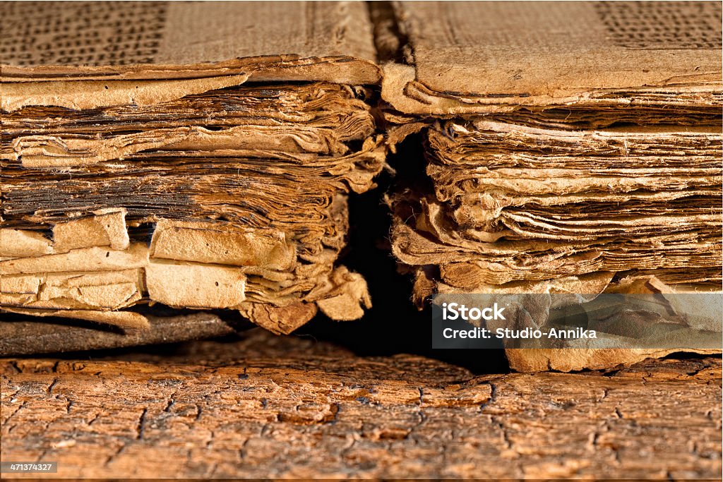 Tattered pages of antique book Closeup on weathered pages of an antique 300 years old gothic book Ancient Stock Photo