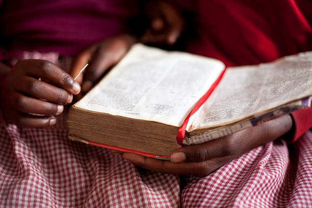 istock African School Girl reading Bible 471374891