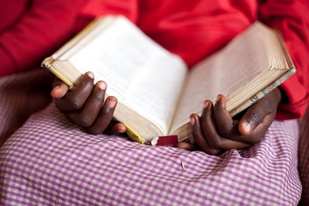 istock African School Girl reading Bible 471374893