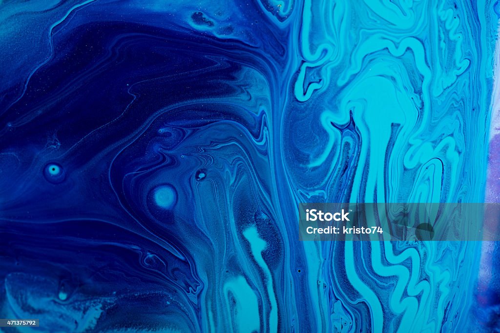 Mixed paint. Different colors of wet acrylic paint mixed. Blue Stock Photo
