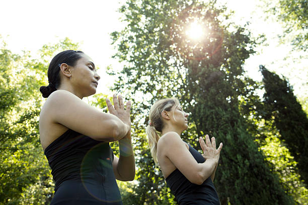 istock Women Doing Yoga Outside 471376022