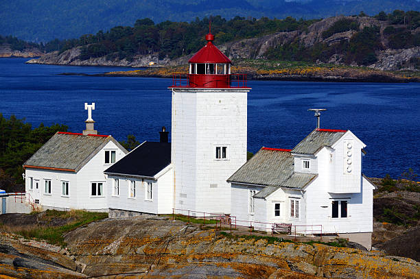 istock White buildings lighthouse on the rocks 471376114