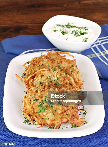 Potato Latkes And Sour Cream Vertical Stock Photo - Download Image Now - Latke, Blue, Chopped Food