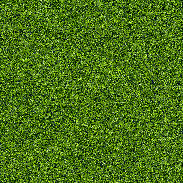 Close up of the texture of green artificial grass stock photo