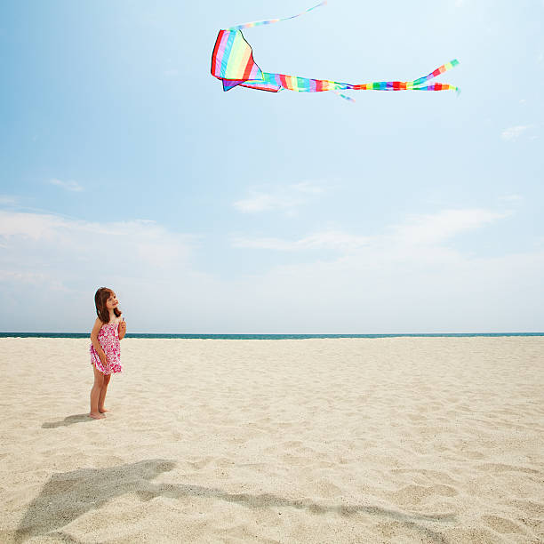 istock Happy girl with kite 471378671
