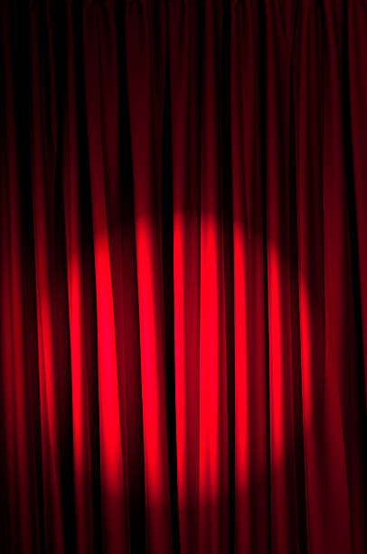 istock Brightly lit curtains in theatre concept 471380479