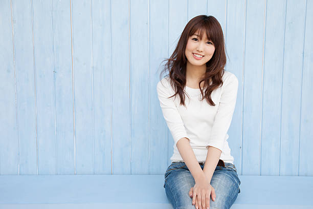 The empty space in the blue background of Asian women and fluttering hair