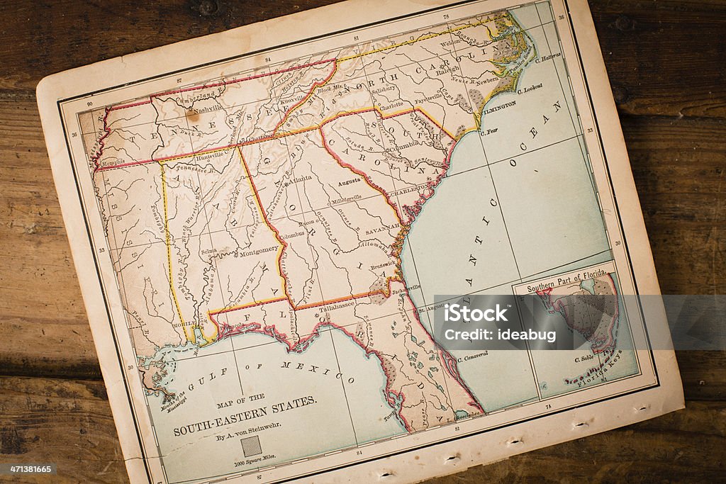 Old, Map of South Eastern States, Sitting Angled on Trunk Color image of an old map of the South Eastern (United) States, sitting at an angle on antique wood trunk. Map Stock Photo
