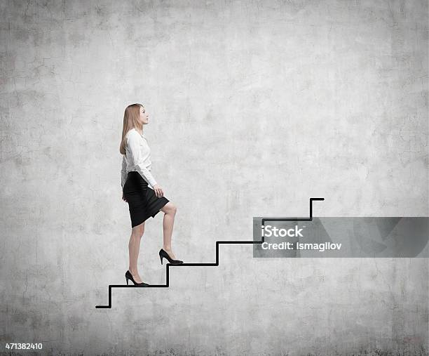 Young Business Woman Is Going Up To The Stairs Stock Photo - Download Image Now - Staircase, Moving Up, Side View