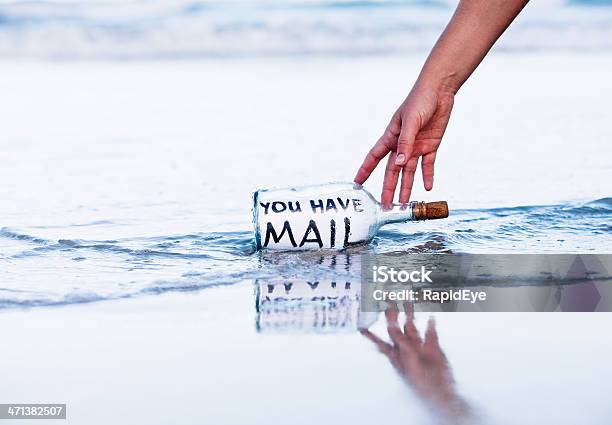 Modern Message In Bottle On Beach Says You Have Mail Stock Photo - Download Image Now