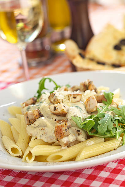 Penne with chicken and gorgonzola Penne with chicken and blue cheese chicken rigatoni stock pictures, royalty-free photos & images