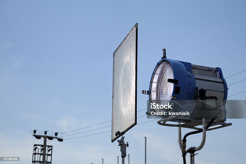 movie lights and soft filter High powered spotlights illuminating an outdoor movie set. Film Set Stock Photo