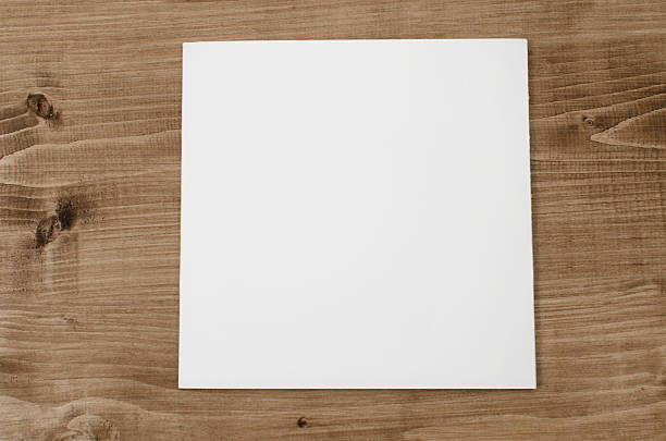 istock White blank paper brochure isolated on a wooden background 471387704