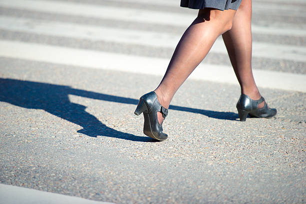 istock Woman crossing street 471388295