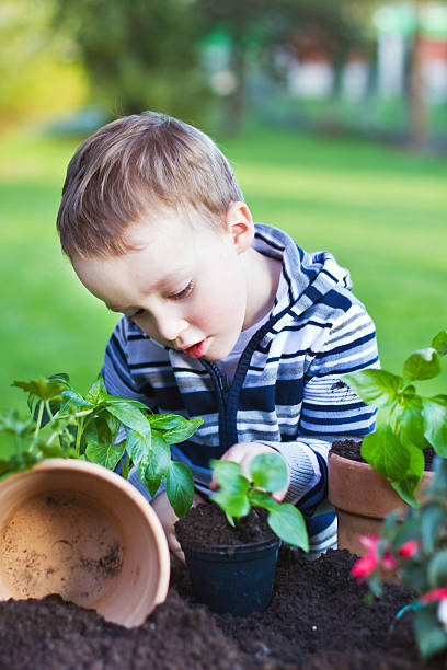 istock Toddler gardening 471388531