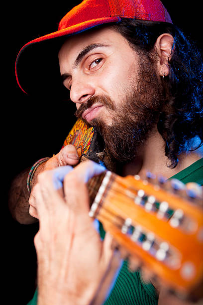 istock Musician playing small guitar at concert 471389025
