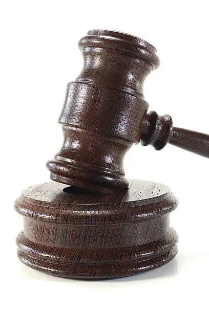 brown judges gavel of wood on a light background