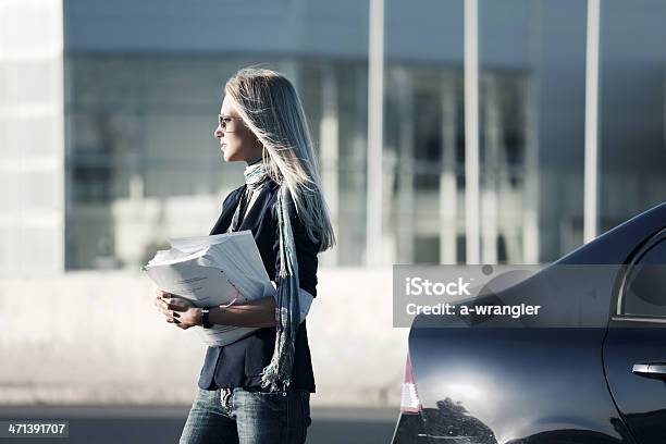 Young Businesswoman With Financial Reports Stock Photo - Download Image Now - Adult, Adults Only, Beautiful People