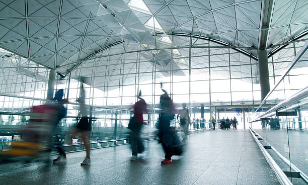 istock Travellers rushing through modern airport 471391957