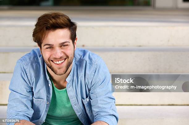 Friendly Young Man Smiling Stock Photo - Download Image Now - 20-24 Years, 20-29 Years, 2015