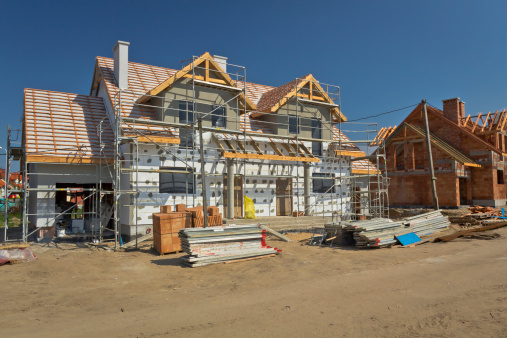 Residential House under construction against blue sky