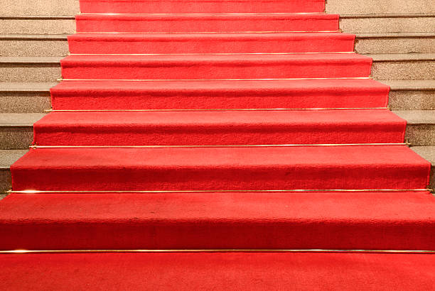 istock Stairs covered with red carpet 471394023