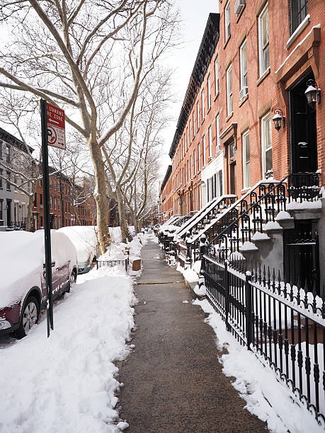 istock Sidewalk with Stoops and Cars in Snow 471394160