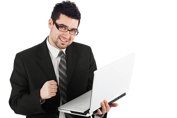 istock excited businessman with laptop 471396341