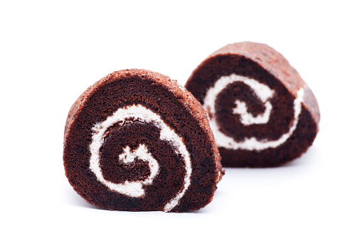 two chocolate swiss roll isolated on white background.