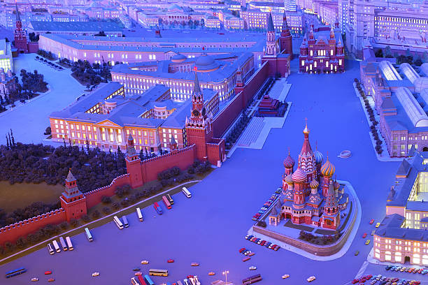 Dozens of travelers, walk through Red Square in Moscow and a chance to visit and photograph the cathedral St. Basil on sunset