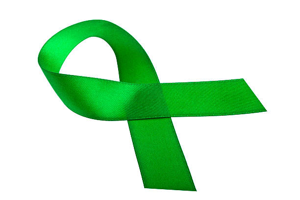 istock Green awareness ribbon isolated on a white background 471397876
