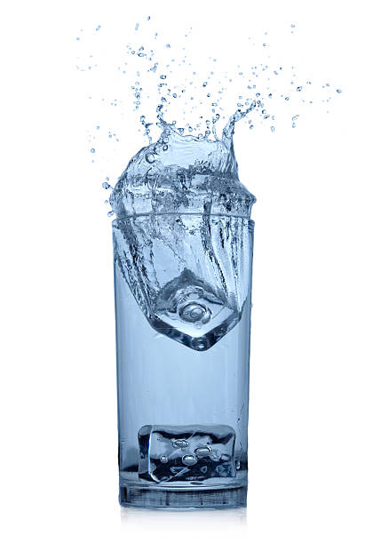 istock Splashing water in glass 471398243