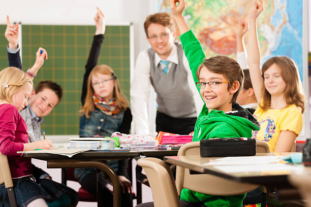 istock Education - Pupils and teacher learning at school 471399713