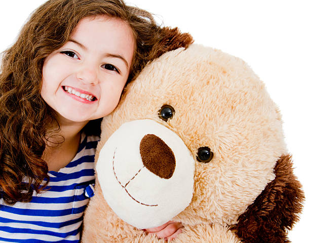 istock Girl with a teddy bear 471399885