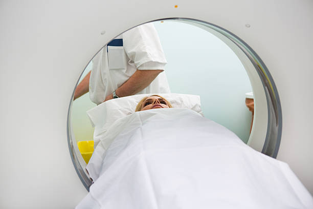 istock Young woman waiting for CAT scan 471399977