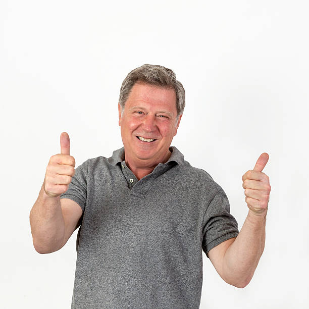 istock smiling mature man with grey polo shirt 471400176