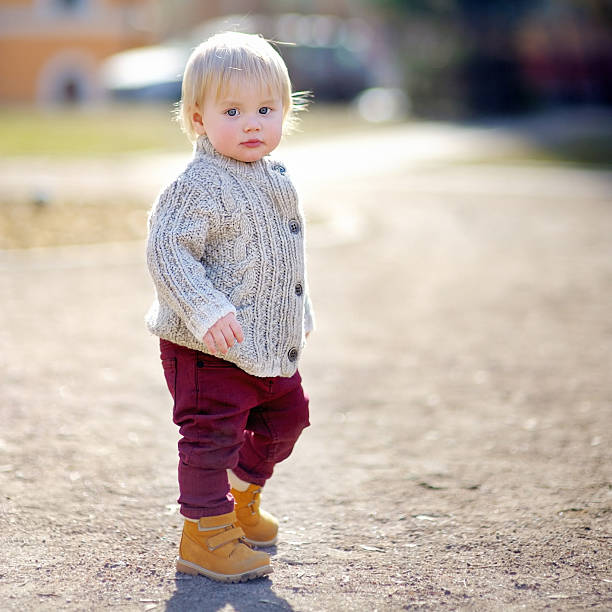 istock Beautiful toddler boy walking 471400564