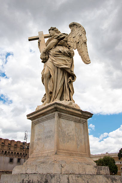 istock Angel Marble Statue holdong a cross 471400630