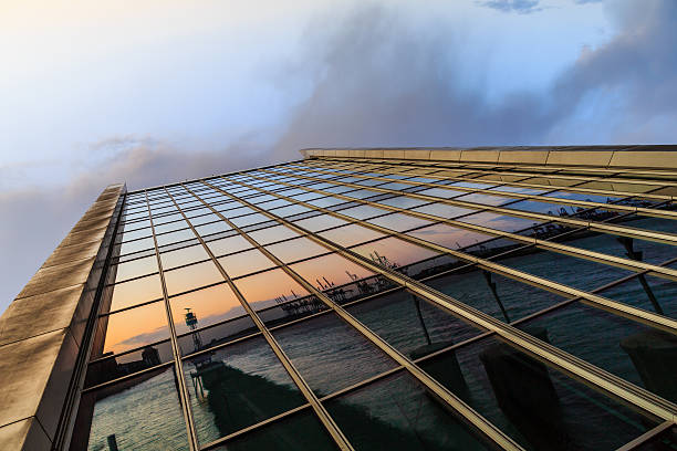 Facade of an office building with reflections in the windows