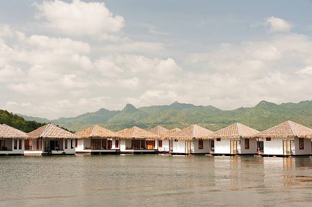 istock floating hotel rooms on lake. 471402685