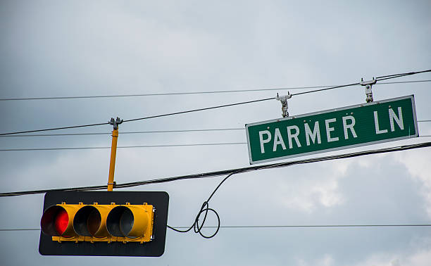 istock Parmer Lane Street Sign with Red Light Austin Texas 471404590