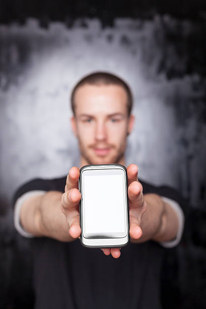istock Man showing screen of smartphone 471405697