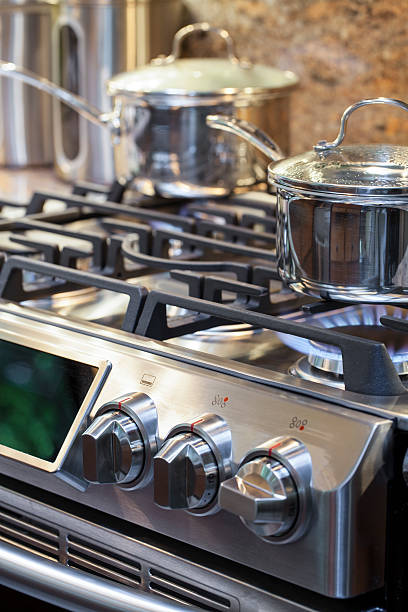 istock Pot on stove with gas burner and flame 471406892