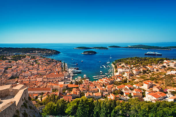 Harbor of old Adriatic island town Hvar. High angle panorama. stock photo