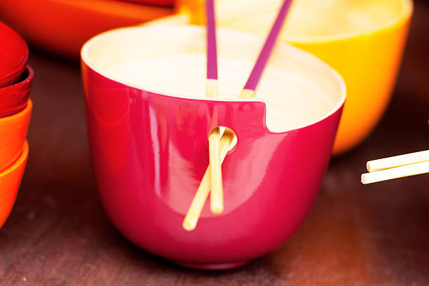 istock Wooden colored thai bowl with chopsticks 471407494