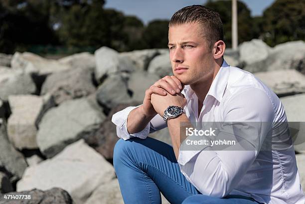 Confident Man Sitting And Thinking Stock Photo - Download Image Now - 20-24 Years, 2015, 25-29 Years