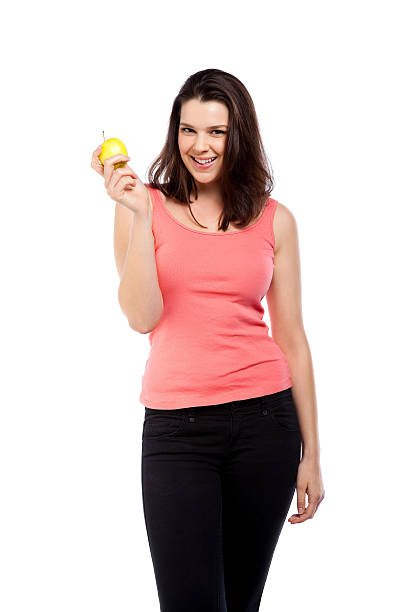 istock Healthy eating - Happy young lady with an apple 471408143