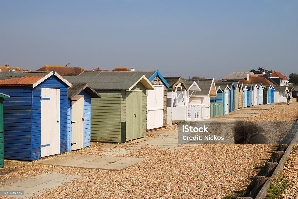 Beach huts at Ferring. West Sussex. England Assorted beach huts at Ferring near Worthing. West Sussex. England. With shingle beach. Architecture Stock Photo