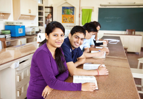 Group of Indian students learning in classroom