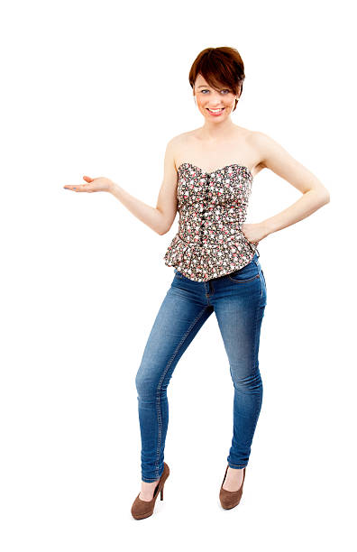 Attraktive brunette female with pointing hand on white